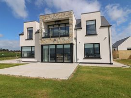 A modern house with stone features and large windows at Ard Uisce @ Estuary Bliss Duncannon, County Wexford