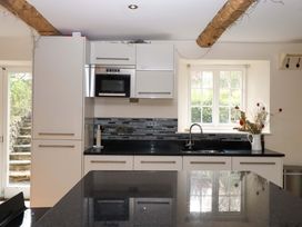 A kitchen featuring cabinets, a sink, and a countertop at The Mill House in Newton Abbot