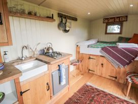 A kitchen area with a sink and stovetop at Honeysuckle Hut, Potto Grange Farm Northallerton