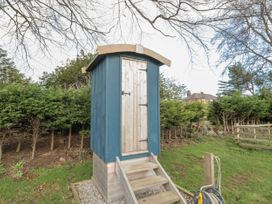 An outdoor shed with stairs at Honeysuckle Hut, Potto Grange Farm Northallerton