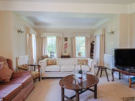 A living room with a sofa and coffee table at Goulds Farmhouse Milborne St Andrew