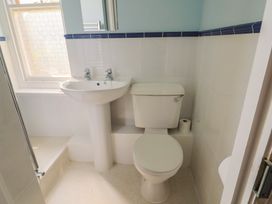 A bathroom with a sink and toilet at Goulds Farmhouse in Milborne St Andrew