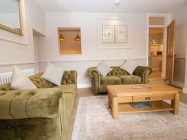 A living room with a sofa and coffee table at Flat 5 Caxton House in Windermere