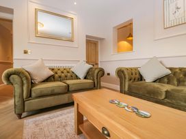 A living room with two sofas and a coffee table at Flat 5 Caxton House Windermere