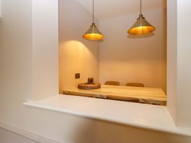A dining room with a table and chairs at Flat 5 Caxton House in Windermere