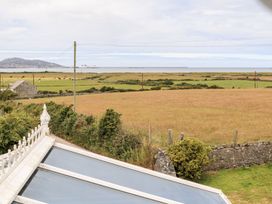 A view of grassland and sea at Bodlasan Groes Cottage Holyhead