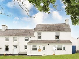 A house with a door and windows at Bodlasan Groes House in Holyhead