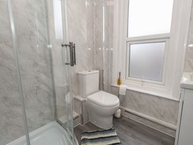 A bathroom featuring a shower, toilet, and sink at 93 Abbotsbury Road in Weymouth