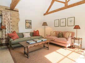 A living room with a sofa and armchairs at The Forge in Broadway near Stow-On-The-Wold
