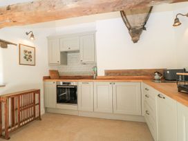 A kitchen with cabinetry and appliances at The Forge in Broadway near Stow-On-The-Wold