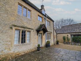 An outdoor view of a stone house with plants at The Smithy in Stow-On-The-Wold