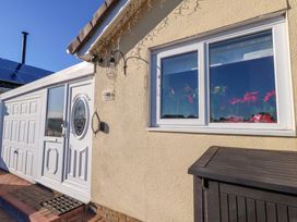 An exterior view of a house with a door and a window at 46 Chafeys Avenue