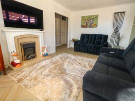 A living room featuring a fireplace and sofa at 46 Chafeys Avenue