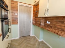 A kitchen with oven and wooden worktop at 46 Chafeys Avenue
