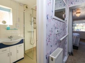 A bathroom with a sink and shower at 46 Chafeys Avenue