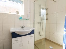 A bathroom with a sink and shower at 46 Chafeys Avenue