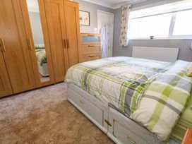 A bedroom with a bed and wardrobe at 46 Chafeys Avenue