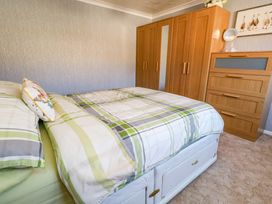 A bedroom with a bed and furniture at 46 Chafeys Avenue 