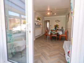 A dining room with a table and chairs at 46 Chafeys Avenue