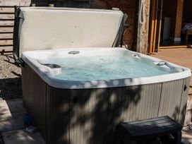 A hot tub with cover in an outdoor area at The Chard in Carlisle