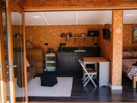 A studio with a kitchenette and seating area at The Chard in Carlisle