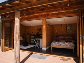 A bedroom with a bed and a small seating area at The Chard in Carlisle