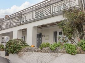 A house with a balcony and plants at Rock House in Narberth