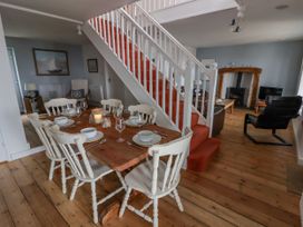 A dining room with a table set for dinner at Rock House in Narberth