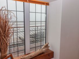 A view from a window with driftwood and a wooden box at Rock House in Narberth