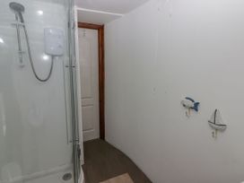 A bathroom with a shower and decor at Rock House in Narberth