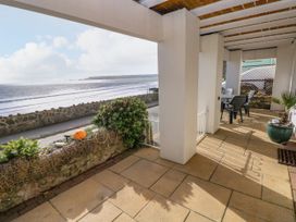 A patio overlooking the ocean at Rock House in Narberth