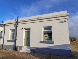 A building exterior with a door and windows at Hornblower Lodge in Whitby