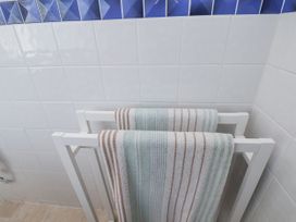 A towel rack with towels at Hornblower Lodge in Whitby
