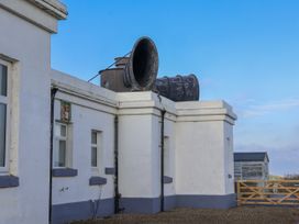 A building with a horn speaker on the roof at Hornblower Lodge in Whitby