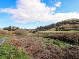 A landscape featuring a castle in the background at 82 Manorbier Park Manorbier