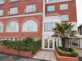 A building with windows and an entrance at One Union Mill - garden apartment in Whitby