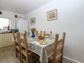 A dining room with a table and chairs at Parc y Brenin Holidays, Abersoch