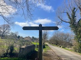 A signpost indicating footpaths to Cricklade and South Cerney near Cerney Wick
