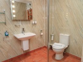 A bathroom with a sink and toilet at Meadow Lodge in Cerney Wick near South Cerney, Cotswolds