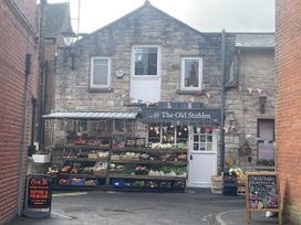A shop front with vegetables and fruits at The Old Stables in Swanage