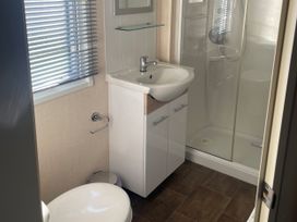 A bathroom with a sink and shower at Swanage Bay View in Swanage