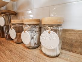 Glass jars with wooden lids for sugar and sweeteners at Ingleside Cottage Whitby