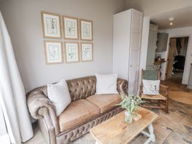 A living room with a sofa and coffee table at Ingleside Cottage in Whitby
