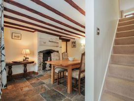 A dining room with a table and chairs at Little Blagdon in Beaworthy