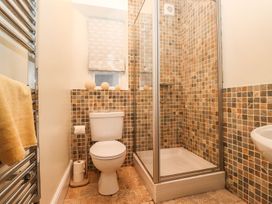 A bathroom with a shower and toilet at Waterhead Cottage in Ambleside