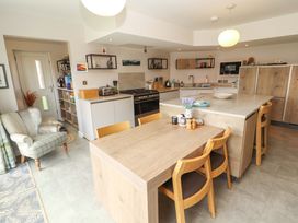 A kitchen with a dining table and appliances at Lakes View in Keswick