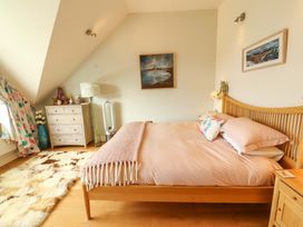 A bedroom with a bed and drawers at Lakes View in Keswick