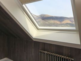 A skylight view of mountains in an attic at Lakes View in Keswick