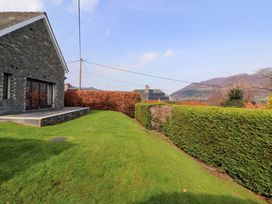 A house exterior with yard and hedges at Lakes View in Keswick