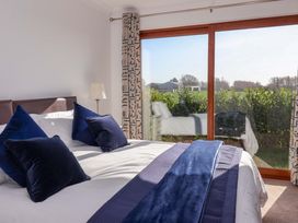 A bedroom with a bed and window at Star Carr Lakes